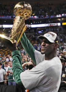 Boston Celtics' Kevin Garnett holds the NBA Championship trophy after the Celtics' 131-92 win over the Los Angeles Lakers in Game 6 of the NBA basketball finals Tuesday, June 17, 2008, in Boston. (AP Photo/Elise Amendola)